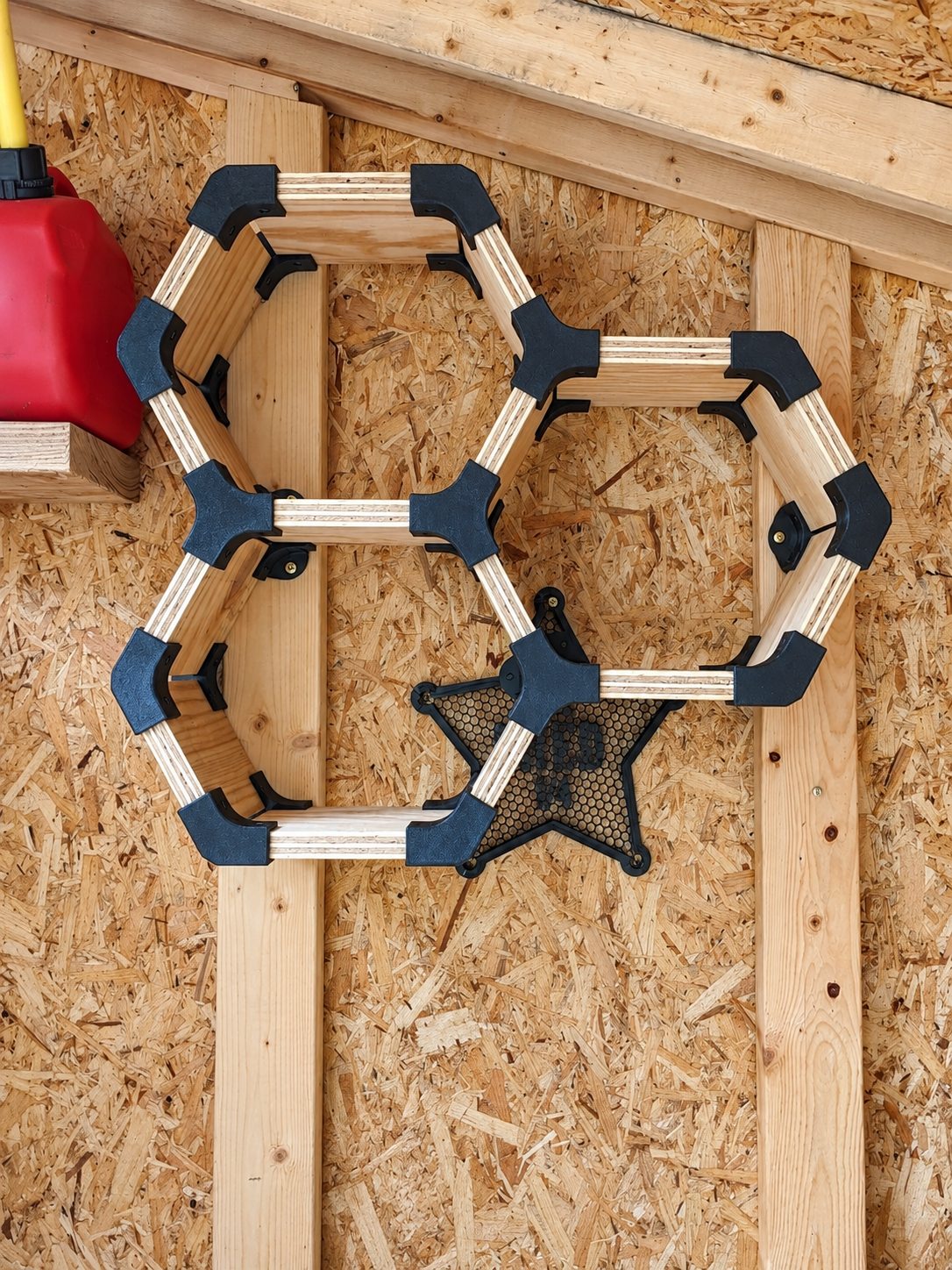 Three-cell HexaNect test shelf mounted on a shed wall